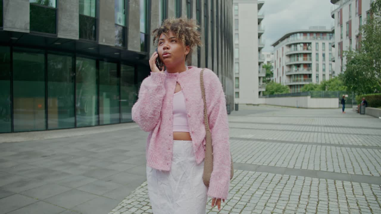 Woman talking on the phone in an urban setting