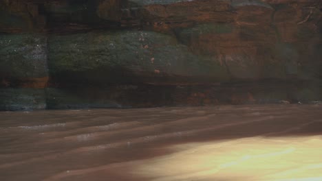 peaceful pond waterfall in a cave, clear and bright water waves
