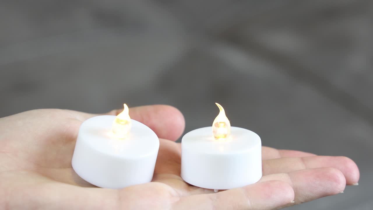 Fake LED candle lights turning on and off
