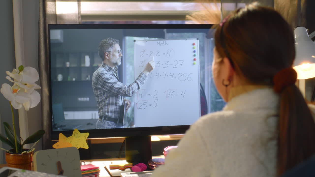 Student attending online math lesson at home