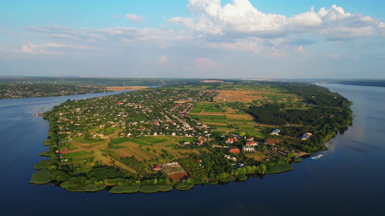 Drone's Lens Capturing the Picturesque Beauty of Nature's Embrace, over Majestic Dniester River and Molovata Village, Birds-eye View