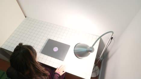 woman working on laptop at home