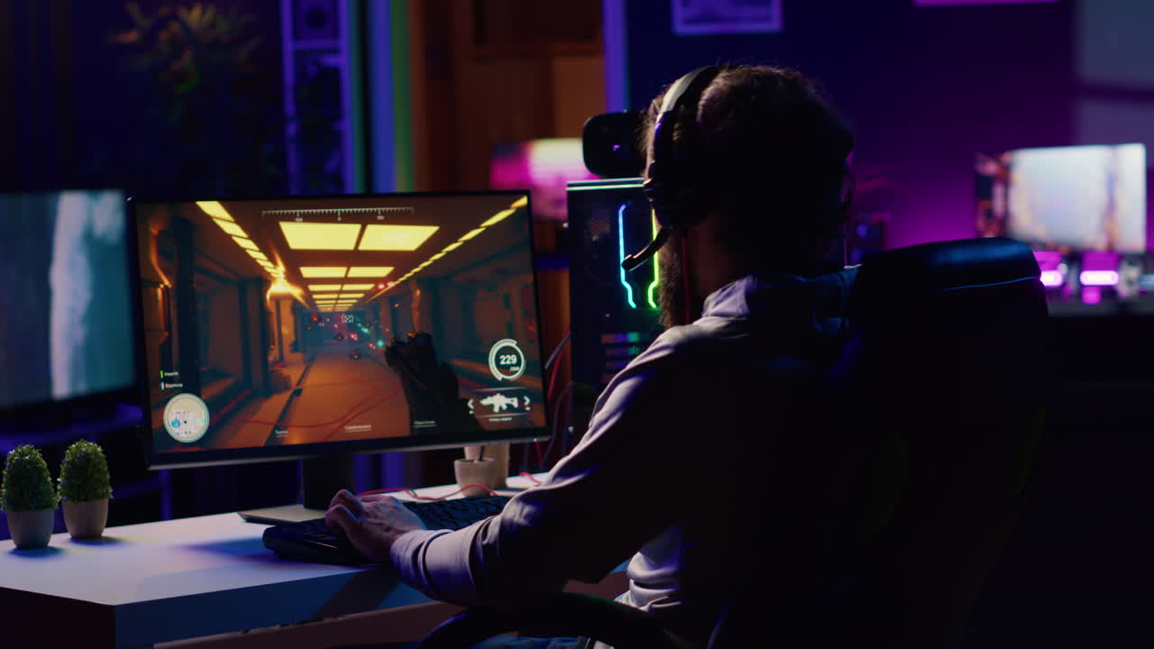 Man putting on headphones to communicate with teammates while playing first person shooter videogame