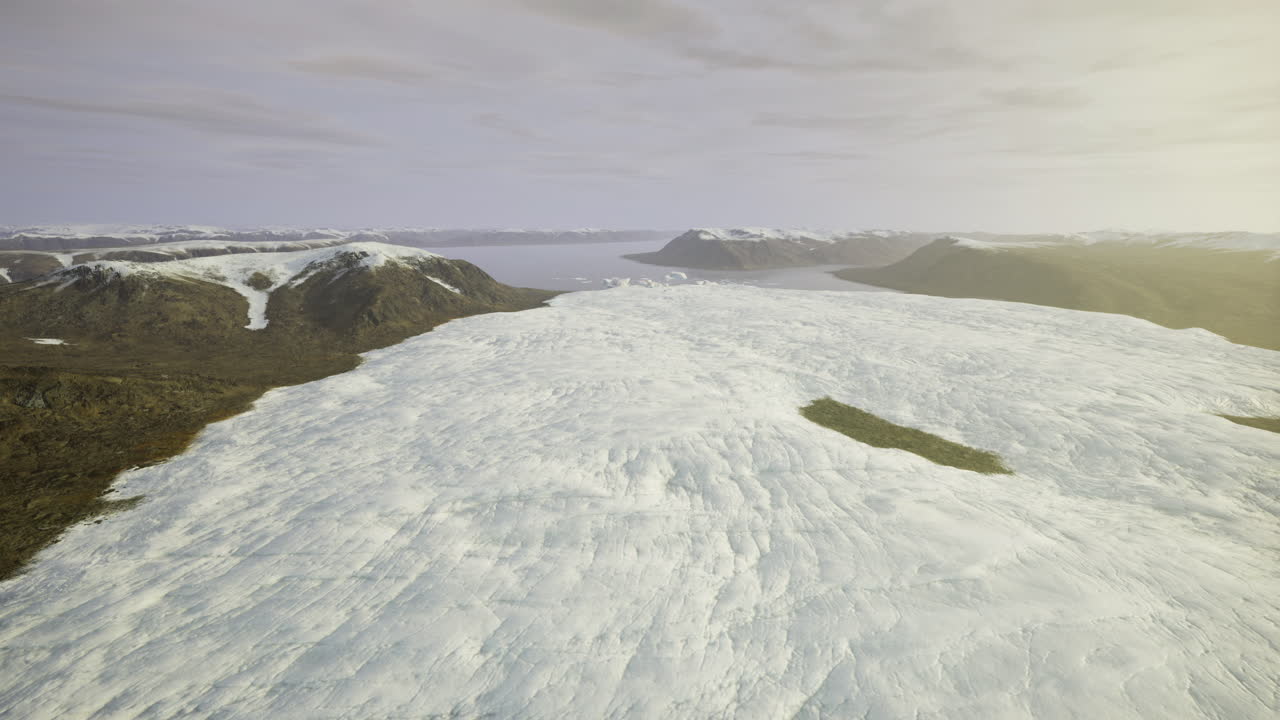 Glacier landscape with expansive ice and rugged mountains under a soft sky