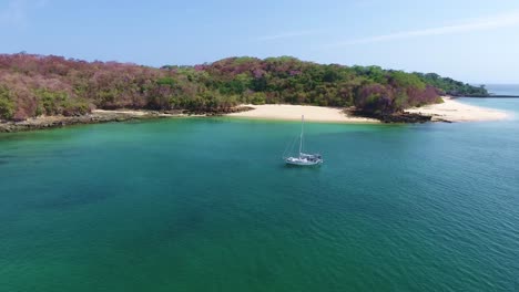 "Hovering-Aerial-View-of-Sailing-Yacht-in-the-Las-Perlas-Islands-with-White-Sand-and-Coral-Beaches-