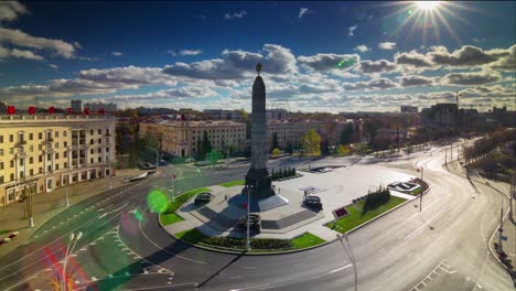 sunny day minsk city victory monument traffic circle rooftop view 4k timelapse belarus