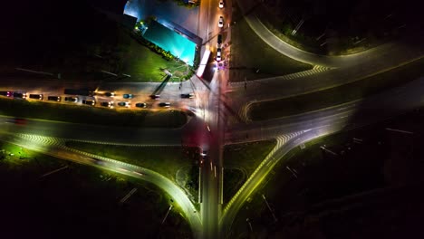 4k aerial time lapse. top view traffic of roads, expressways, motorways and highways at night.