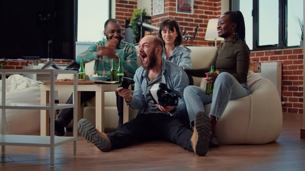 Diverse group of friends celebrating video games win