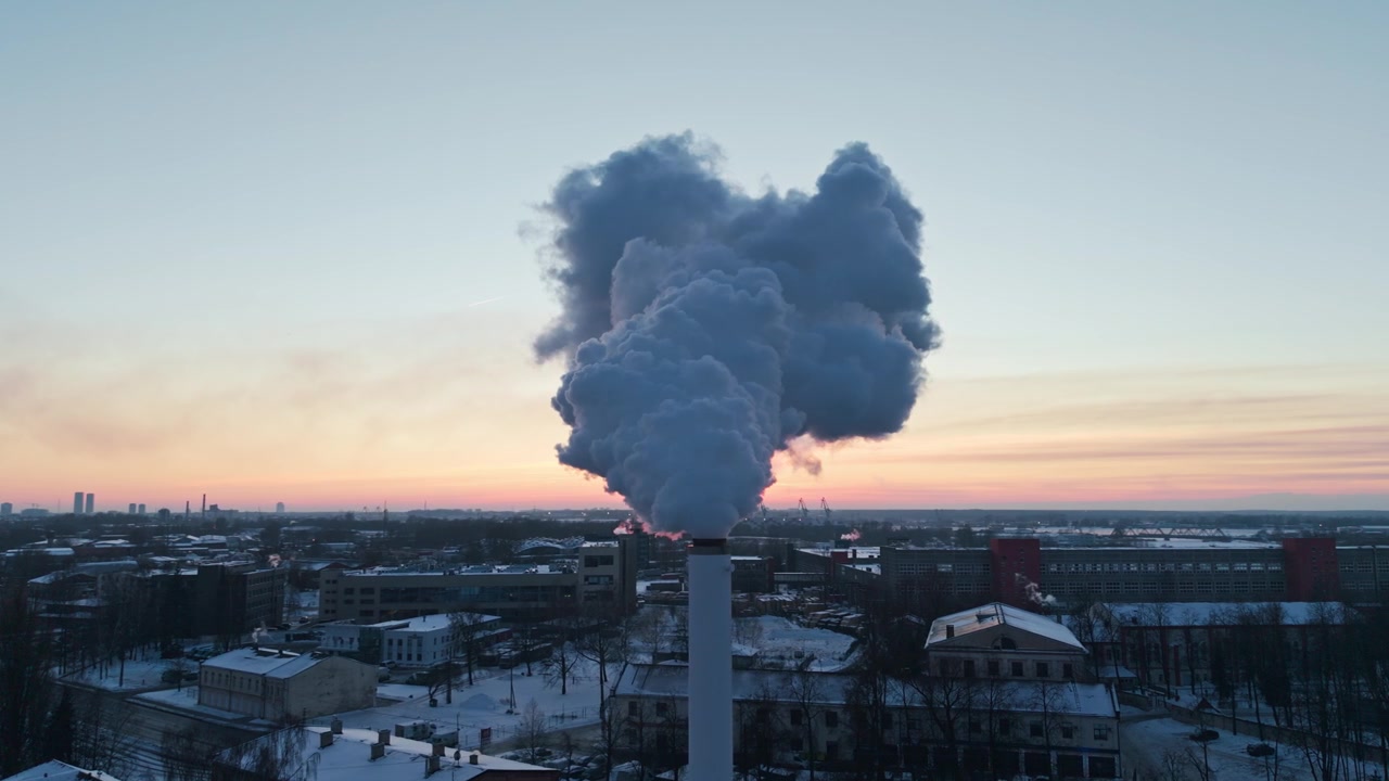 District heat steam towers over snowy Riga, reflecting renewable winter energy