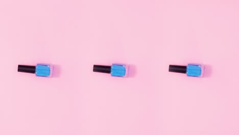 three nail polish bottles rotate and change colors. stop motion