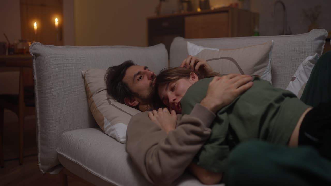 Couple Sleeping on a Couch