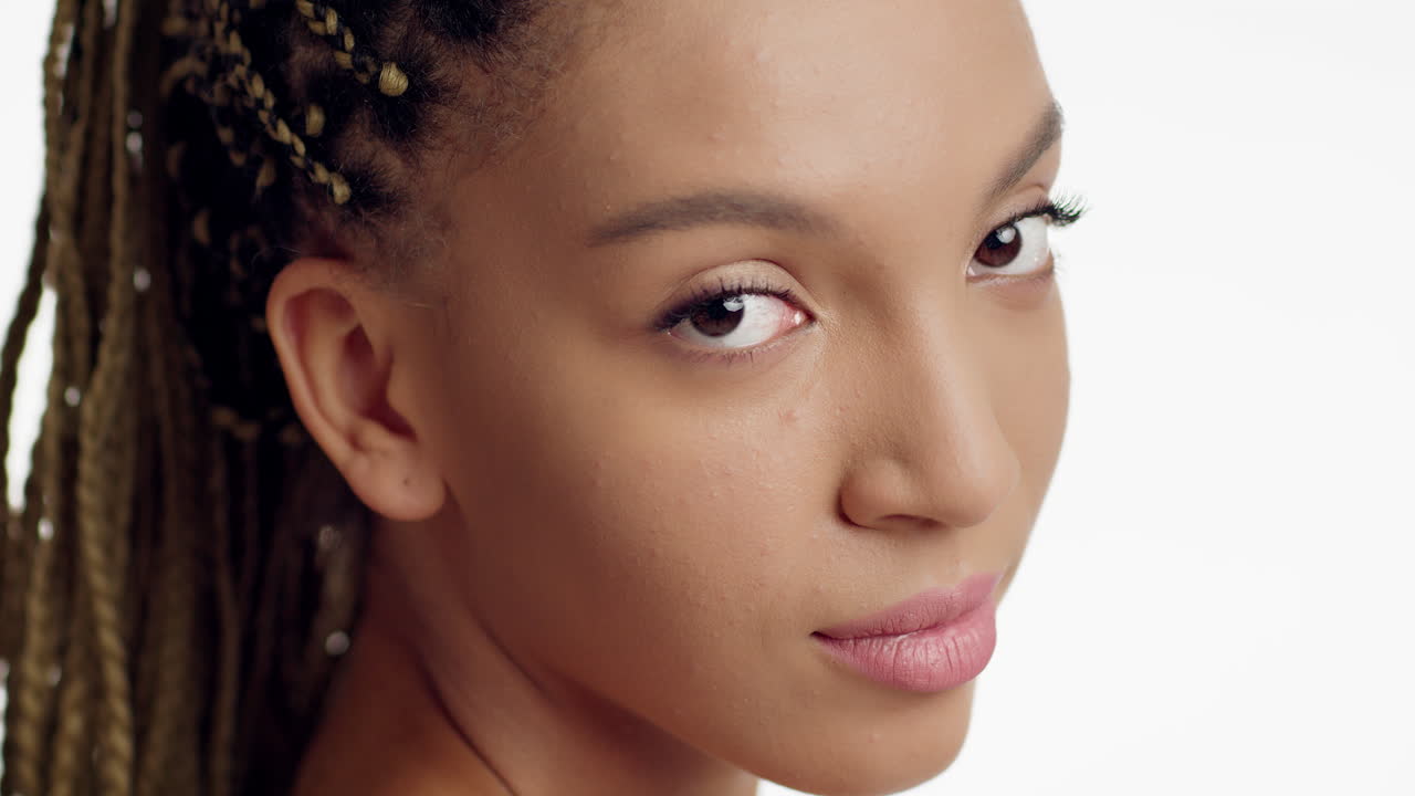 Close-up portrait of a woman with braids