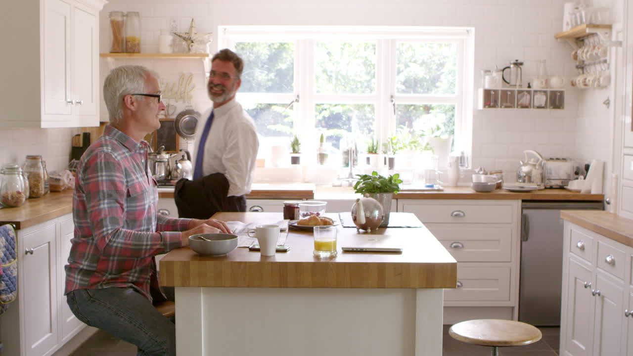 Male Homosexual Couple Saying Goodbye As One Leaves For Work