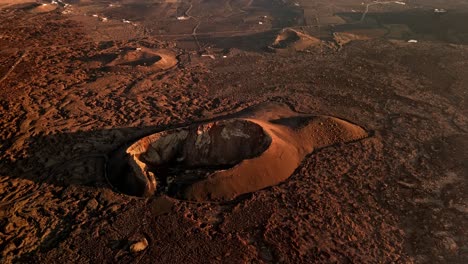 breathtaking aerial drone footage of volcano del cuervo at sunset in lanzarote, canary islands, spain.