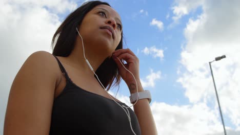 disabled woman listening music on digital tablet 4k