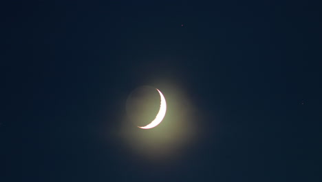 Waxing-crescent-moon-time-lapse-in-the-evening,-medium-shot