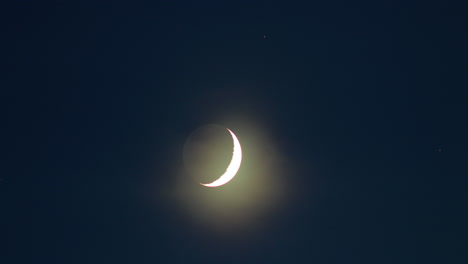 waxing crescent moon time lapse in the evening, medium shot