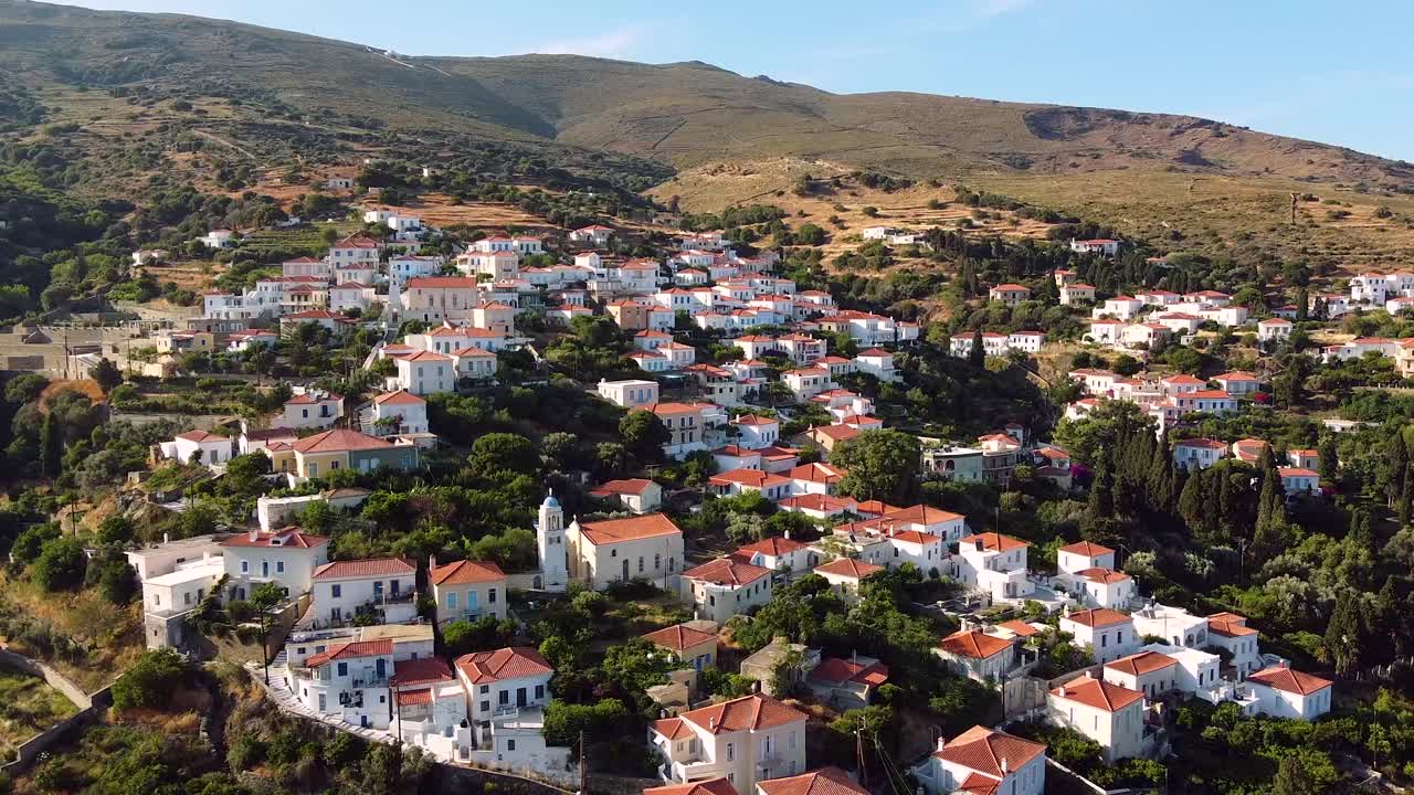 Aerial of Picturesque Stenies Slope Village in Andros at Sunset, Greece