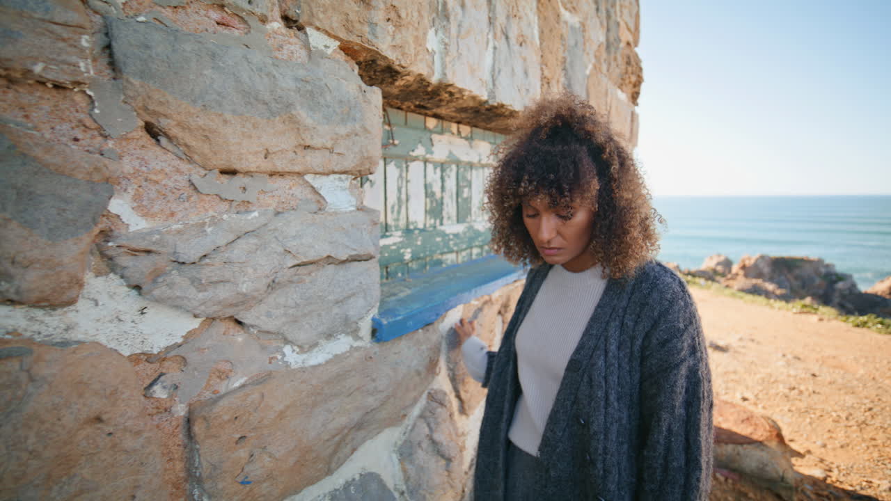 Melancholy girl thinking alone at abandoned place closeup. Woman contemplating