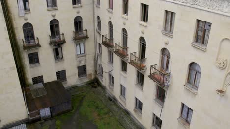 Crane-like-shot-of-entrance-of-abandoned-Metallurgist-Sanatorium-in-Tskaltubo-Georgia