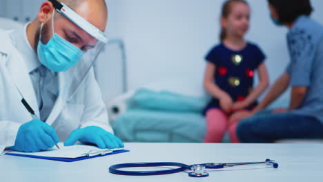 Close-up-of-doctor-wearing-protection-mask-and-gloves