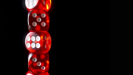stacked red dice on black background