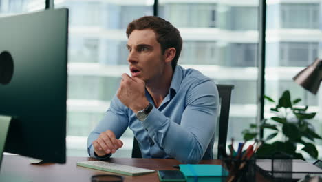 shocked businessman reacting emotionally on work failure sitting office close up