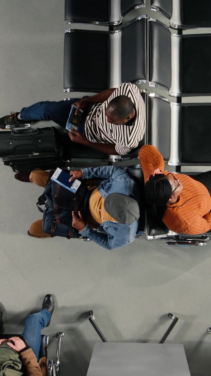 Overhead View of Diverse Passengers Waiting in Airport Lounge