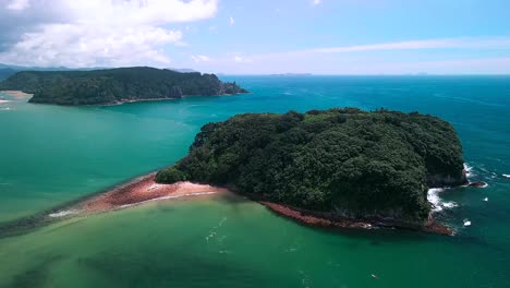 Aerial-views-over-Donut-Island,-Whangamata