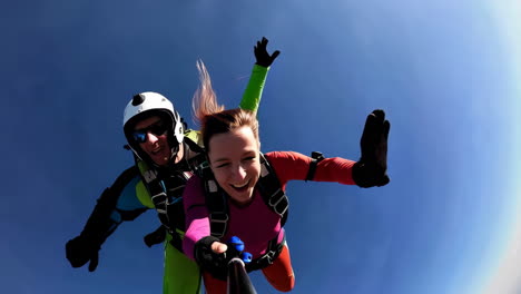 two happy skydivers experiencing the thrill of tandem freefall