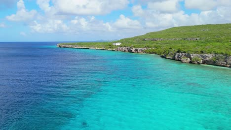 stunning coastal cliffs of curacao caribbean island with deep blue turquoise ocean water