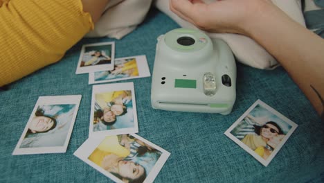 Couple Relaxing on Couch with Instant Camera