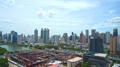 Time-lapse-of-construction-along-the-river's-edge-in-Bangkok,-Thailand