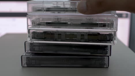 Retro-Cassette-Taps-being-Stacked-On-Top-Of-Each-Other