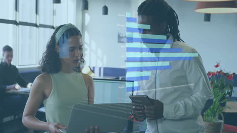 female and male professionals reviewing business data on tablet in modern office with data overlay