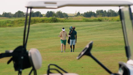 caucasian woman and african american man on the golf course.