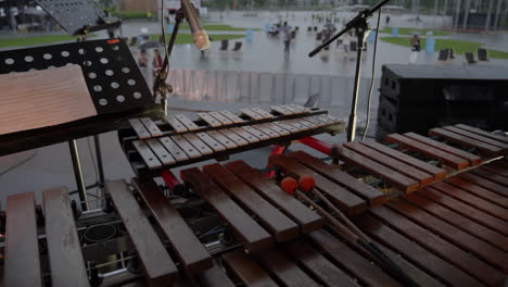 vibraphone and other percussion instruments at an outdoor concert in the rain