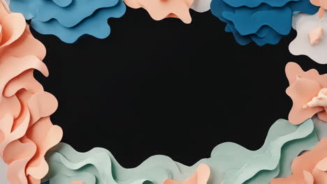 abstract pastel paper cutout frame on black background
