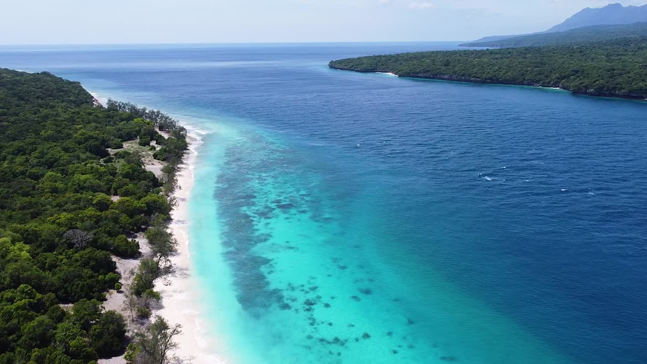 Aerial flying over remote Jaco Island on tropical island of Timor-Leste, Southeast Asia with idyllic turquoise ocean water