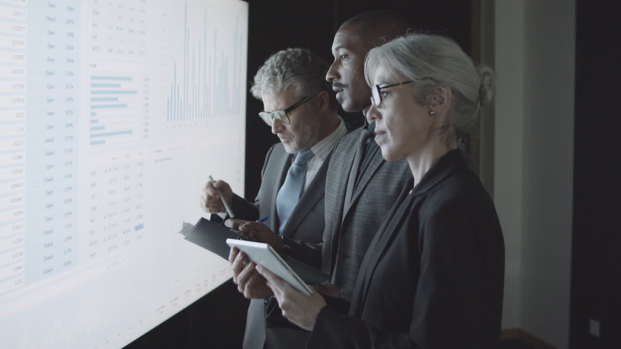 Black male financial expert explaining stock market statistics