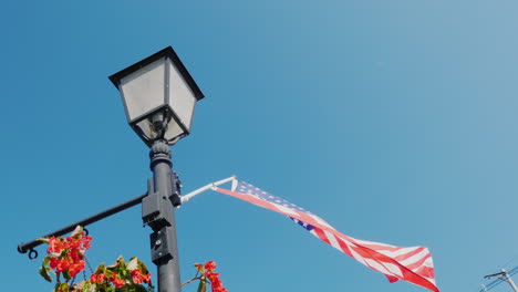 lamppost with flowers and usa flag