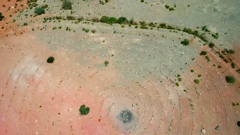 aerial descending view of ancient geoglyphs in the desert