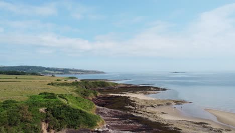 traeth lligwy anglesey eroded coastal shoreline aerial view across scenic green welsh trekking coastline