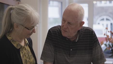 a moment between an elderly couple indoors