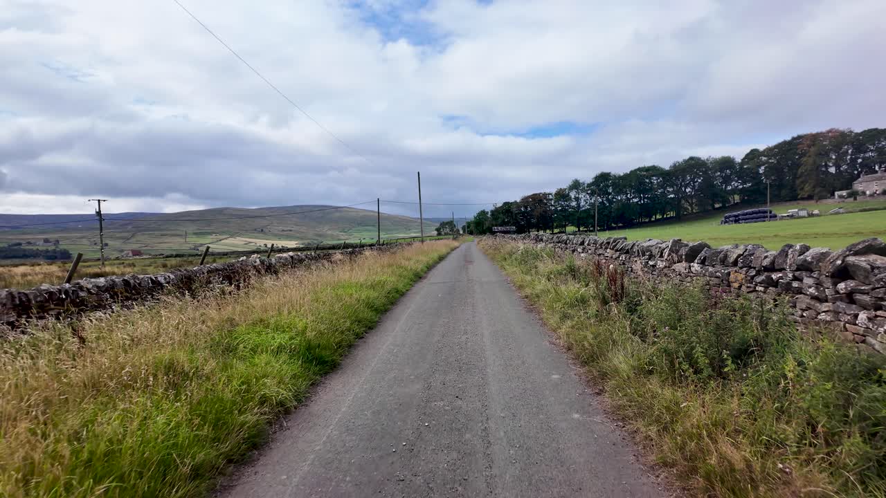 Country road winding through Weardale in County Durham, England