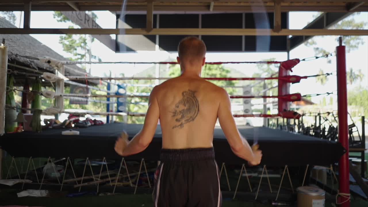 Man skipping rope in a boxing gym