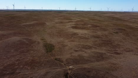 Flying-Towards-Wind-Generators-in-an-Empty-Field-in-Summertime-in-Canada