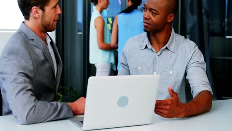 business executives shaking hands with each other
