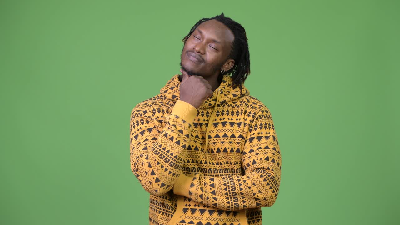 Young handsome African man thinking