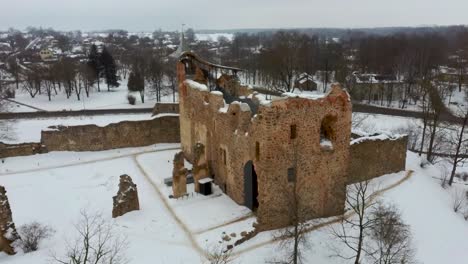 ruins of ancient livonian order's stone medieval castle latvia aerial drone top shot from above